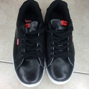 black levi’s with white sole and red detailing.